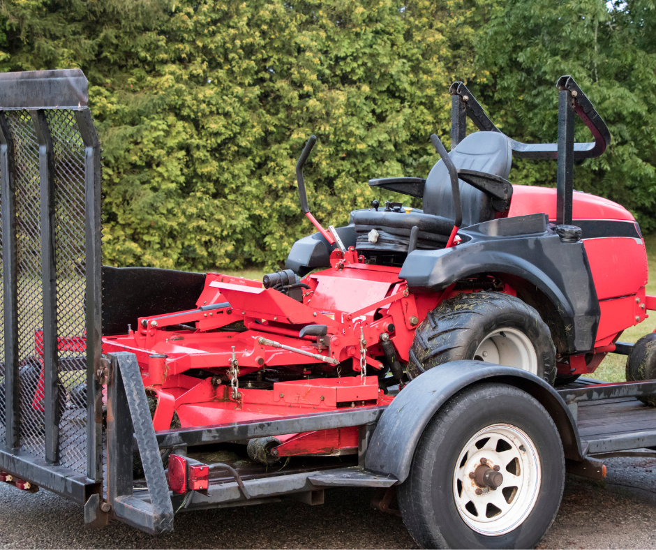 A large red gas-powered riding mower