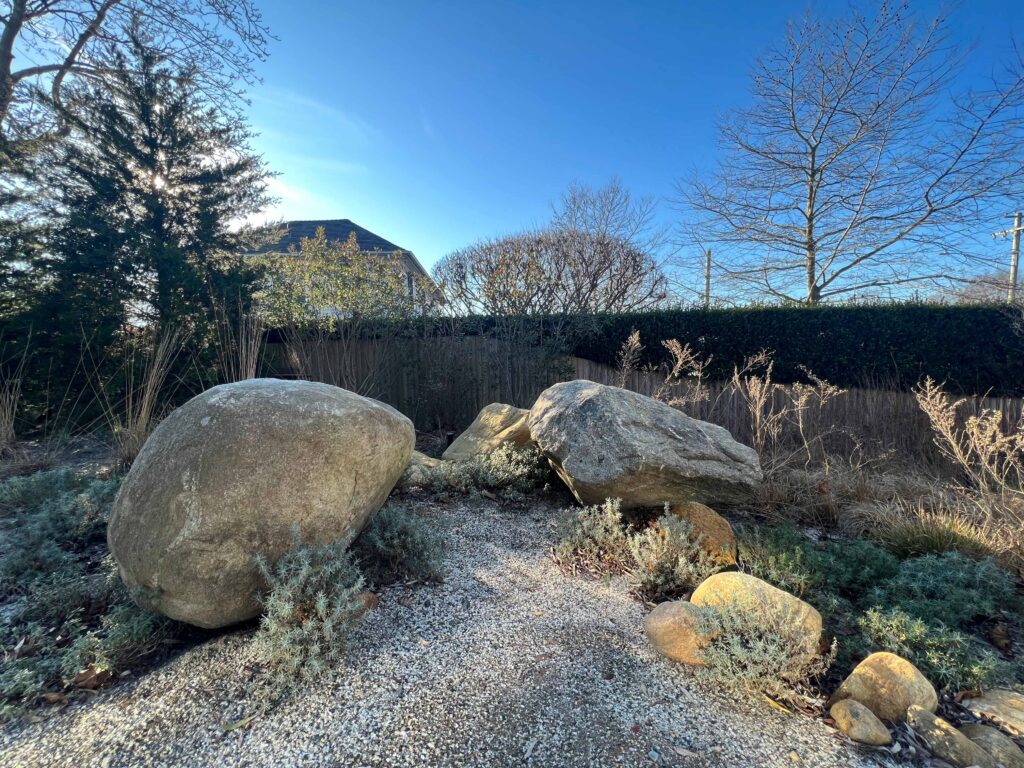 A collection of rocks creates a sculptural gathering space.