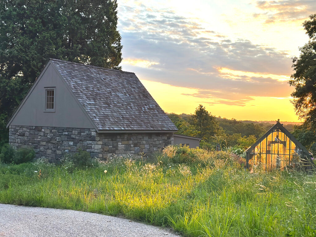 The Mianus River Gorge lies below the new greenhouse and barn, which is surrounded by a naturalistic style planting.